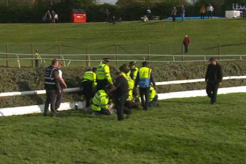 Grand National DELAYED as protesters try to storm track amid huge police presence